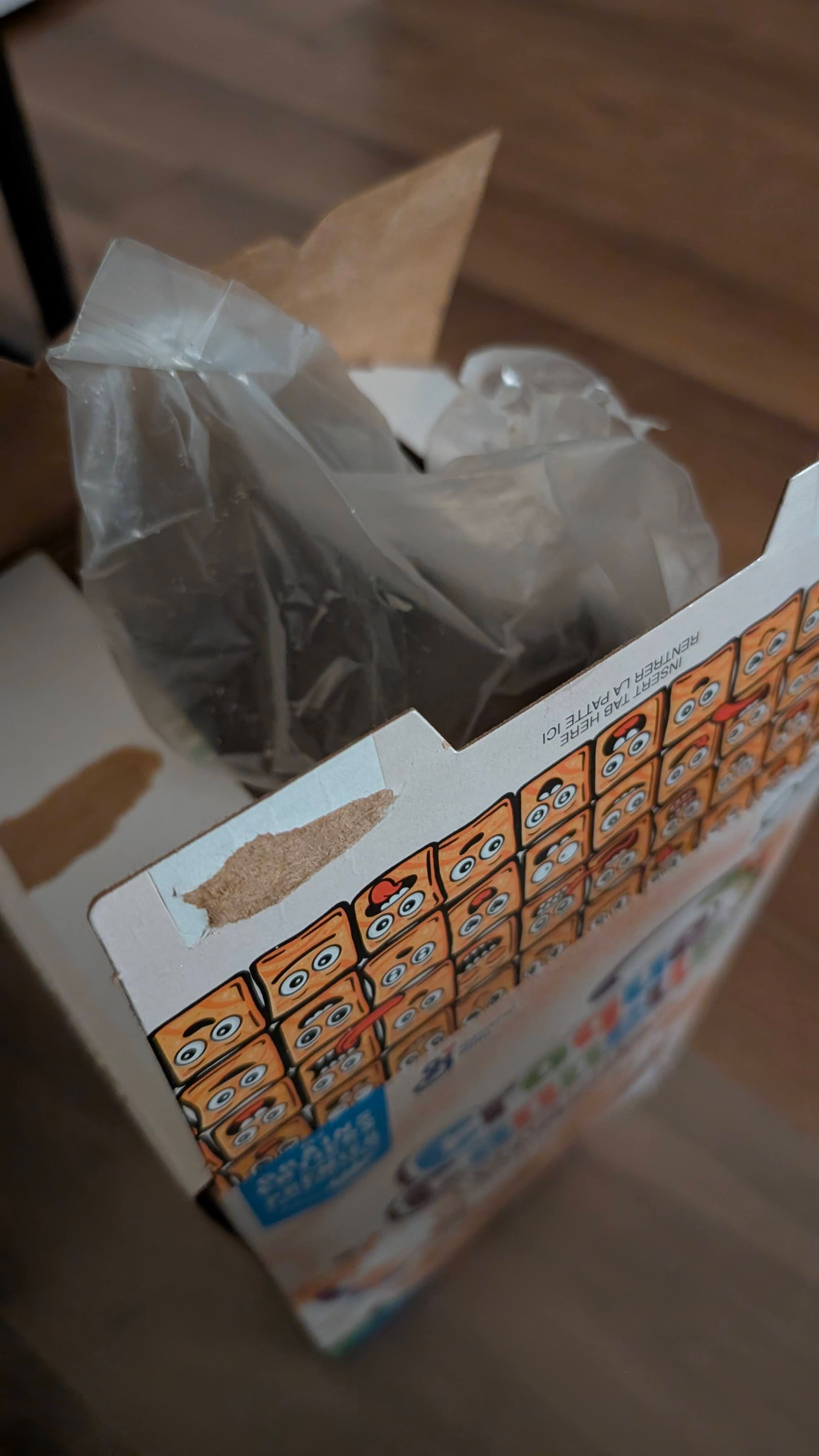 Opening a bag of cereal.