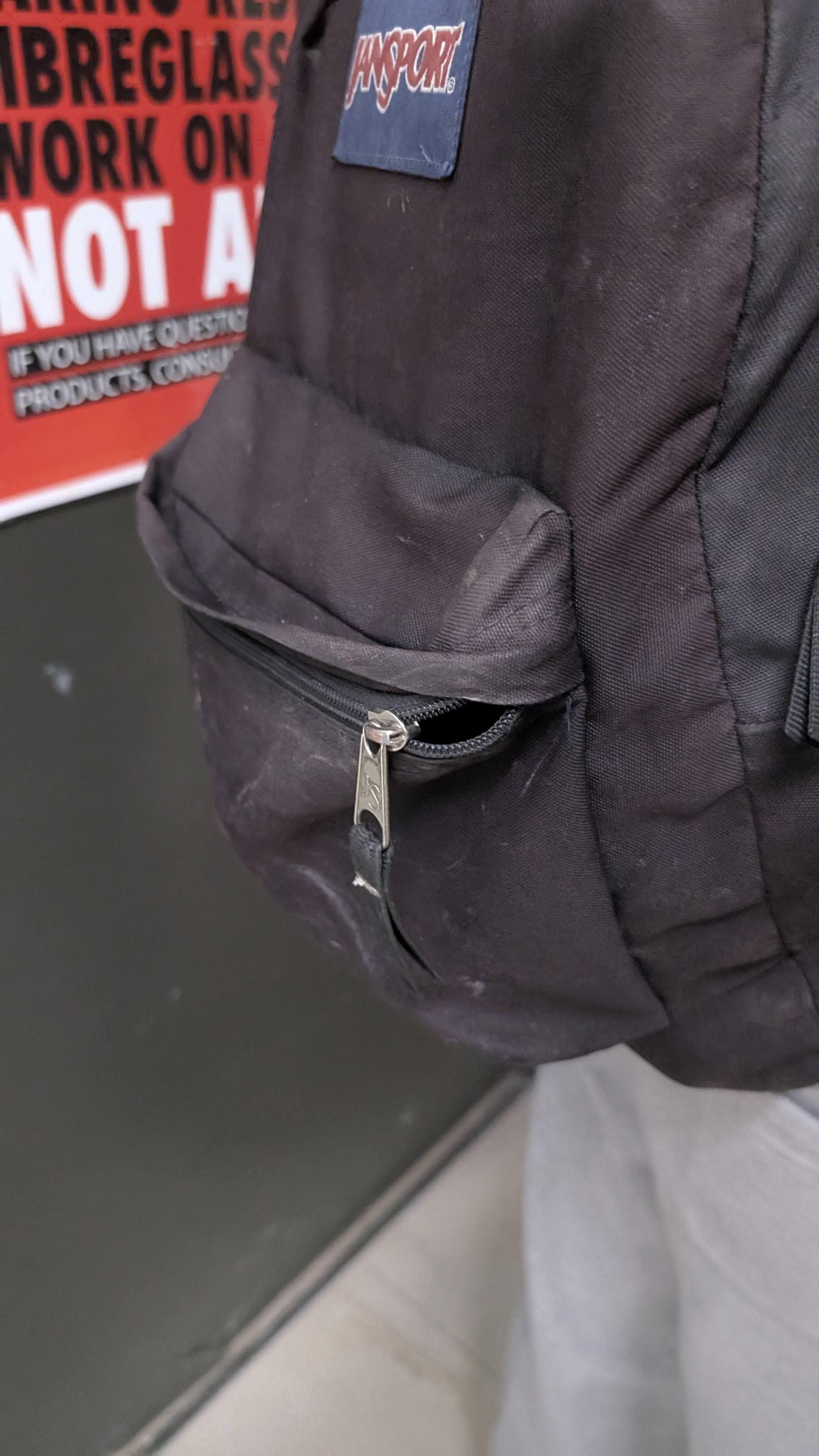 Opened a bag zipper.